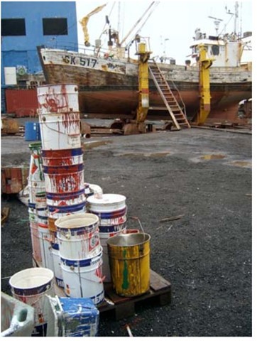 An image showing multiple paint pots in a shipyard   