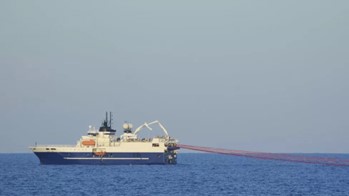 Photo of a seismic survey vessel towing seismic equipment